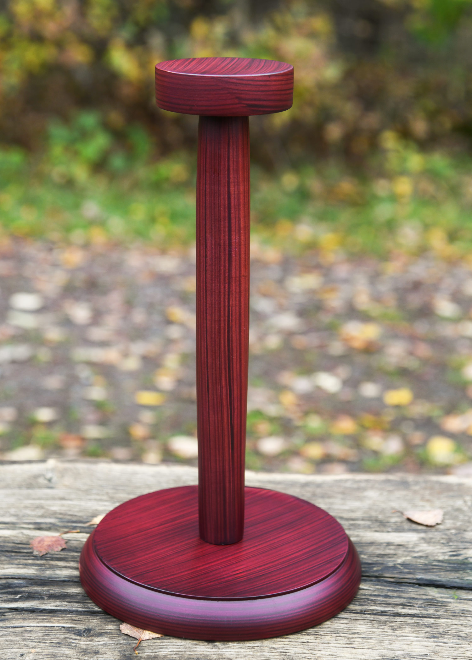 Wooden helmet stand with round base