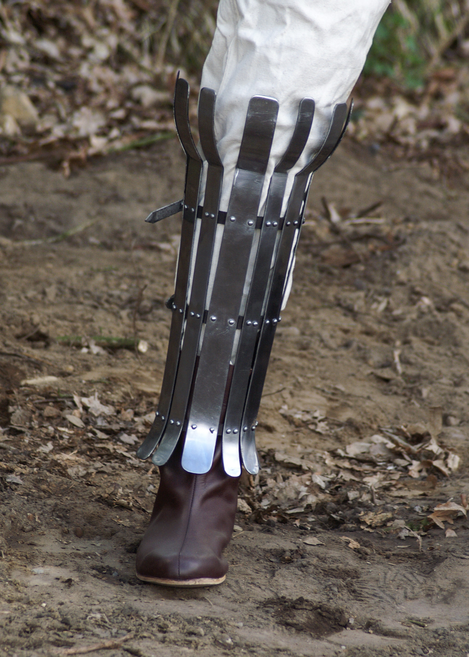 Viking greave from steel flats, 2mm, polished, with leather