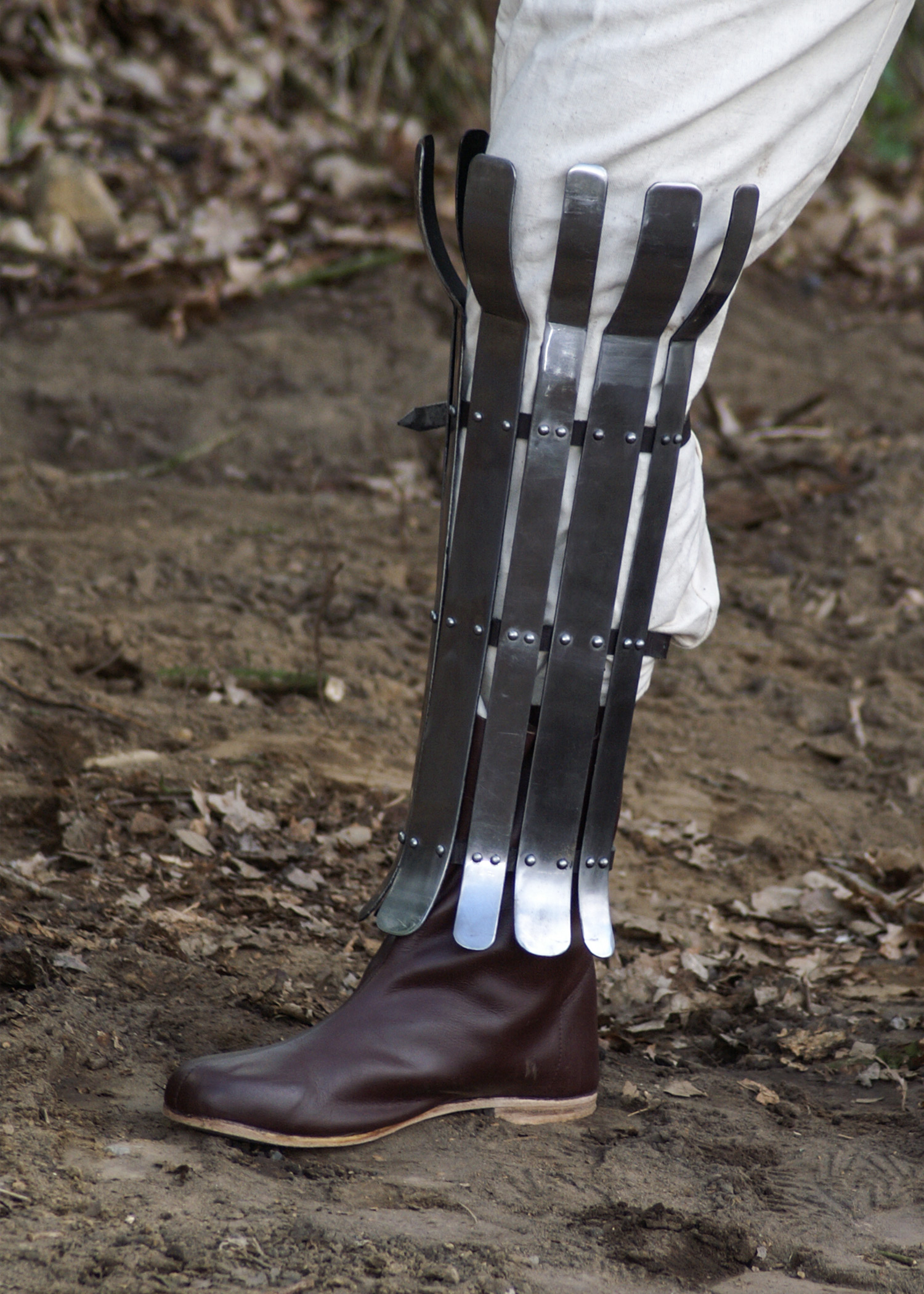 Viking greave from steel flats, 2mm, polished, with leather